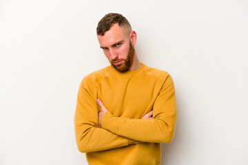 Obraz premium Young caucasian man isolated on white background who is bored, fatigued and need a relax day.