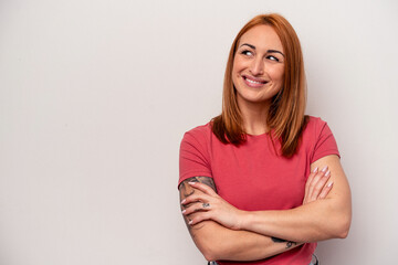 Fototapeta premium Young caucasian woman isolated on white background smiling confident with crossed arms.