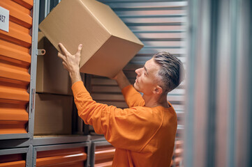 Order picker choosing ordered items for delivery