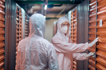 Storehouse worker opening the container lock for his client