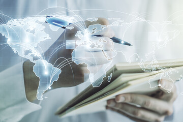 Abstract graphic digital world map with connections and man hand writing in diary on background,...