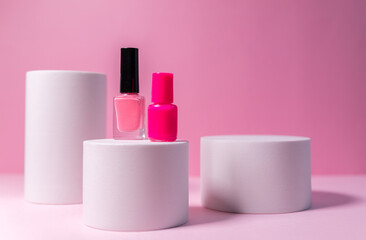 Minimal layout with a podium for product demonstration. Abstract white background of geometric shape on a minimalistic pink background.
