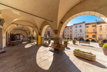 Mondovì, Cuneo, Piedmont, Italy - October 23, 2021: Mondovì Piazza, the arcades of Piazza Maggiore in the center of the old town with its historic buildings