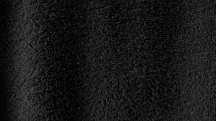 Black luxury soft fluffy fabric texture background with copy space