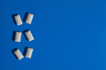white chewing gum on a blue background 