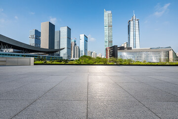 Modern city skyline and commercial buildings with empty floors in Shenzhen, China.