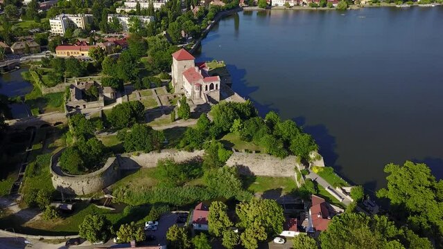 Cinematic 4K aerial drone orbiting footage of the charming historic Tata Castle and &Ouml;reg lake in Kom&aacute;rom-Esztergom county Hungary