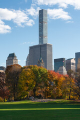 Fototapeta premium New York City Upper East Side skyscrapers from Central Park Sheep Meadow in Autumn. Manhattan luxury building towers