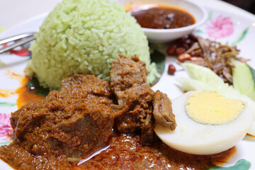 Coconut steam nasi lemak beef rendang chicken berampa fried set half boil egg petai sambal sauce peanut anchovy