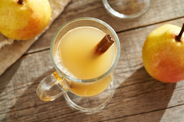 Hot pear beverage on a wooden table
