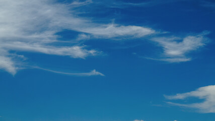 Naklejka na ściany i meble amazing blue sky background with a few white clouds 