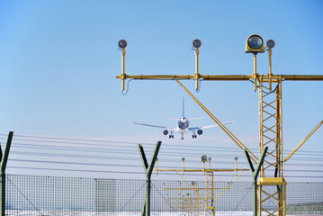 Airplane in the air arriving to the airport for landing