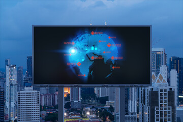 Hologram of Earth planet map on billboard over night panoramic cityscape of Kuala Lumpur, Malaysia, Asia. The concept of international companies in KL. Globe