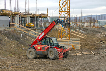 Telescopic Forklift Construction Site © markobe
