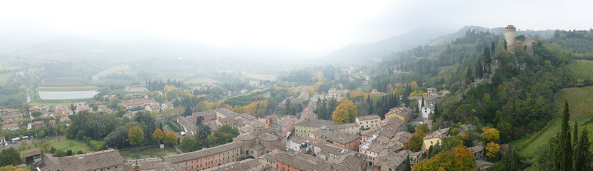 panorama from the clock tower in Brisighella on the green countryside around the hill that...