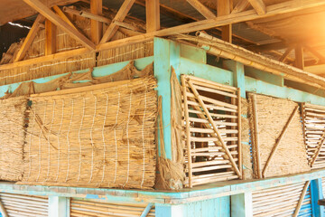 Bar shop built from bamboo trunks and palm leaves, eco-dried material.