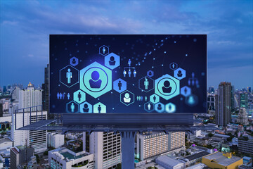 Glowing Social media icons on billboard over night panoramic city view of Bangkok. The concept of...