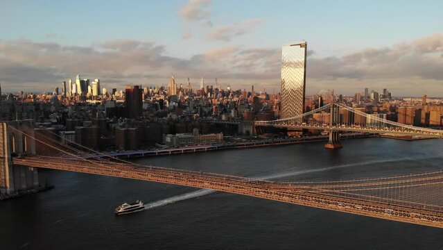 Smooth 4K Drone video in New York city at Brooklyn bridge during sunset. 
30fps - 4K un-edited clip.
Filmed in December 2021 around 5pm.