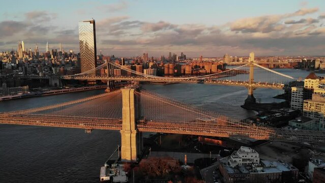 Smooth 4K Drone video in New York city at Brooklyn bridge during sunset. 
30fps - 4K un-edited clip.
Filmed in December 2021 around 5pm.