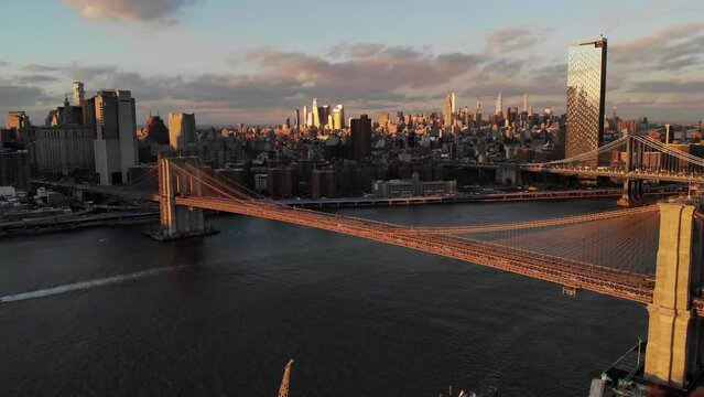 Smooth 4K Drone video in New York city at Brooklyn bridge during sunset. 
30fps - 4K un-edited clip.
Filmed in December 2021 around 5pm.