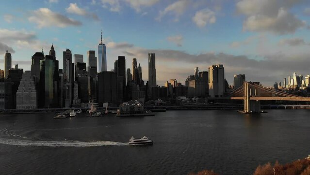 Smooth 4K Drone video in New York city at Brooklyn bridge during sunset. 
30fps - 4K un-edited clip.
Filmed in December 2021 around 5pm.