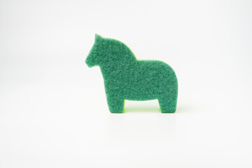 large multi-colored sponge for washing dishes in the form of a horse High quality photo