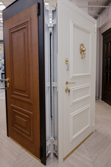 White and brown new modern entrance doors. Doors in the furniture showroom.