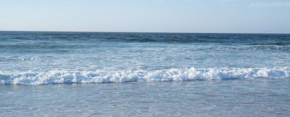 Raging ocean waves. Raging waters. White bureaucratic waves of the sea. Abstract blue sea water with white wave