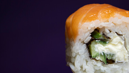 Sushi with Salmon on a Purple Background Closeup. Traditional Japanese Sushi. Closeup Fresh Sushi....
