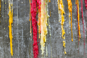 Candle drippings on Old brick wall background