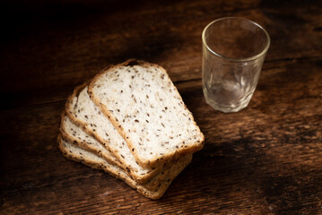 Pieces of bread with seeds on a wooden background. Healthy, healthy bread. Healthy food.