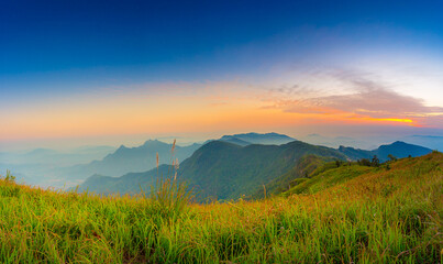 Beautiful landscape nature on peak mountain with sunset in winter at viewpoint Phu Chi Fa or Phu chee fah Forest Park in Chiang Rai , Thailand