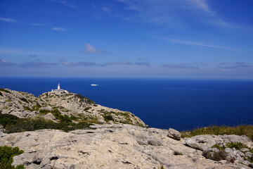 Ferry behind Far de Formentor, lighthouse on Cap de Formentor, Majorca, Spain