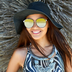 Beautiful happy girl in hat and sunglasses