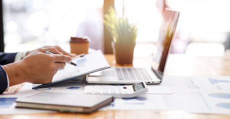 Financial planning Report ,Businessman working at office with documents on his desk, doing planning...