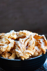  Close up of Angel wings, deep-fried sweet crisp pastry sprinkled with powdered sugar.