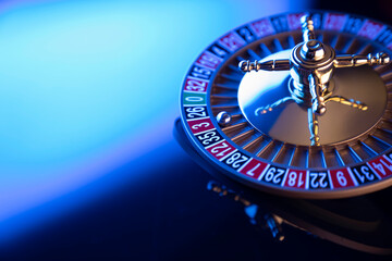 Casino theme.  Roulette wheel on  colorful bokeh background.