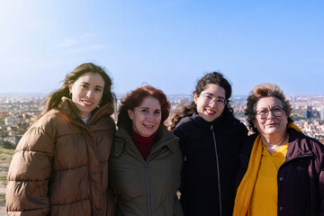 Group of women of different ages smiling embraced. Woman concept. Feminism concept.