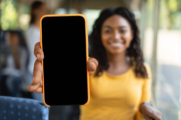 African american lady tourist showing blank smartphone screen, closeup © Prostock-studio