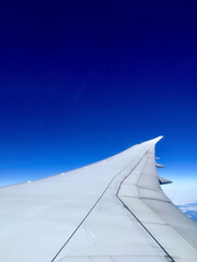 Fototapeta na wymiar Blue sky from airplane window.