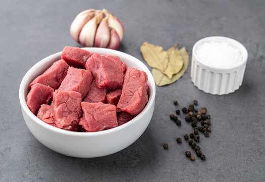 Chopped topside meat in a bowl with seasonings