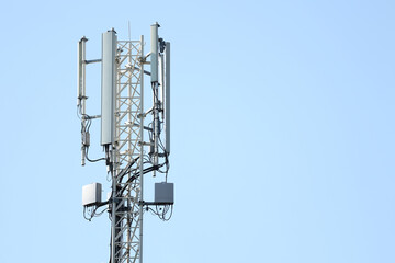 Telecommunication tower of 4G and 5G cellular. 5G radio network telecommunication equipment with radio modules and smart antennas mounted on a metal. Macro Base Station.