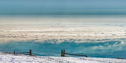 landscape with fog and snow from top of the mountain