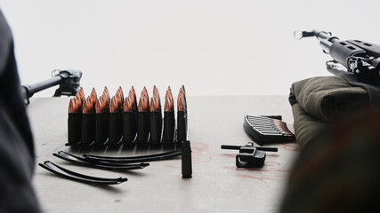 Parons 7.62x39mm for a Kalashnikov assault rifle are waiting for their turn at the shooting range