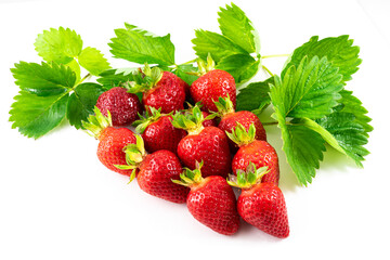Appetizing red strawberry berries with green leaves on a white background