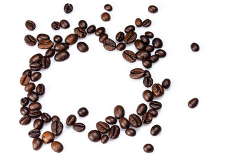 Roasted coffee beans on a white background, place for text