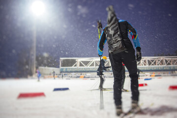 Alpine skiing race slalom competition, athletes ready to start ski competitions on a piste slope, nordic ski skier on the track in winter, giant slalom, winter sport and acitivities concept - obrazy, fototapety, plakaty