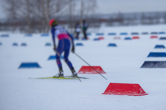 Alpine skiing race slalom competition, athletes ready to start ski competitions on a piste slope, nordic ski skier on the track in winter, giant slalom, winter sport and acitivities concept