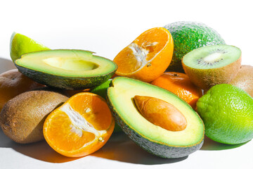 Fruit. oranges, kiwi, avocado, lime, on a white isolated background