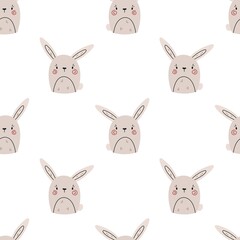 Seamless vector pattern with cute hand drawn bunnies. Fun design. Kawaii background with rabbits for kids room decor, nursery art, wrapping paper, print, fabric, gift, textile, wallpaper, apparel.